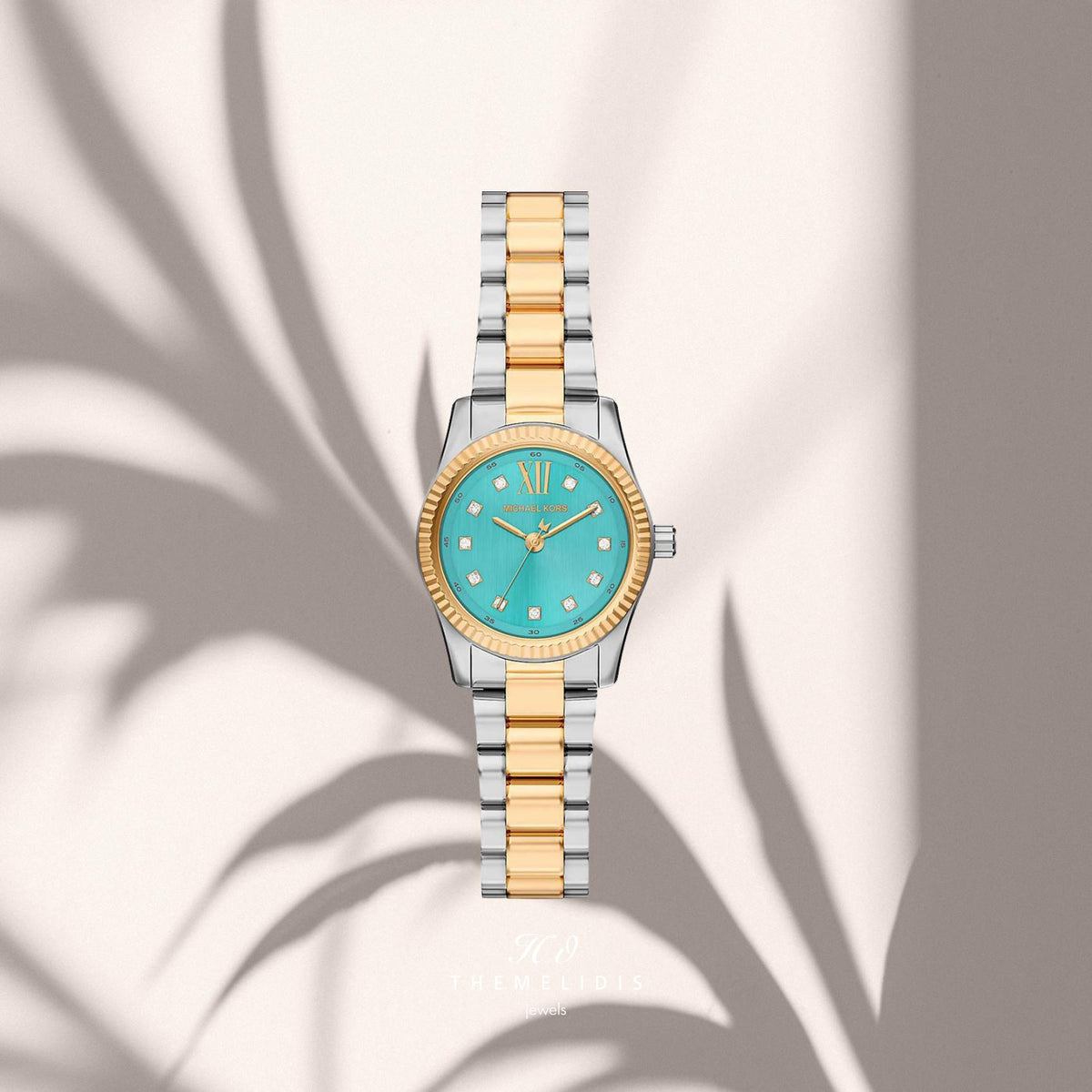 Γυναικείο ρολόι Michael Kors Lexington MK7579 με ασημί-χρυσό μπρασελέ, τιρκουάζ καντράν 26mm με δείκτες ζιργκόν